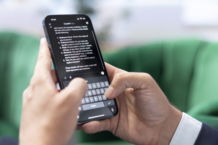 Bucharest, Romania - July 30th 2024 - Man typing prompts into an AI powered chat